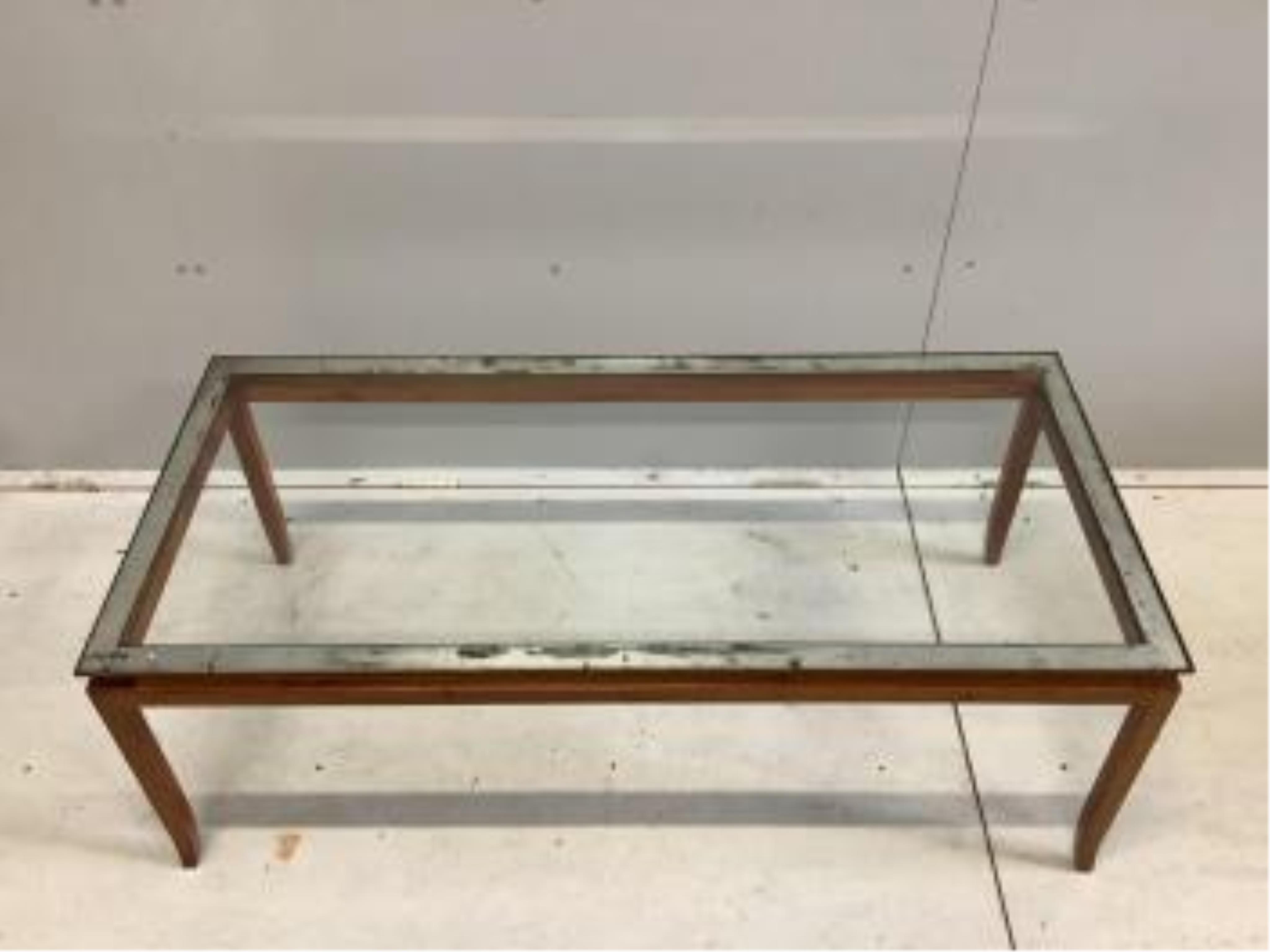 A mid century teak glass top coffee table, width 125cm, depth 58cm, height 45cm. Condition - fair